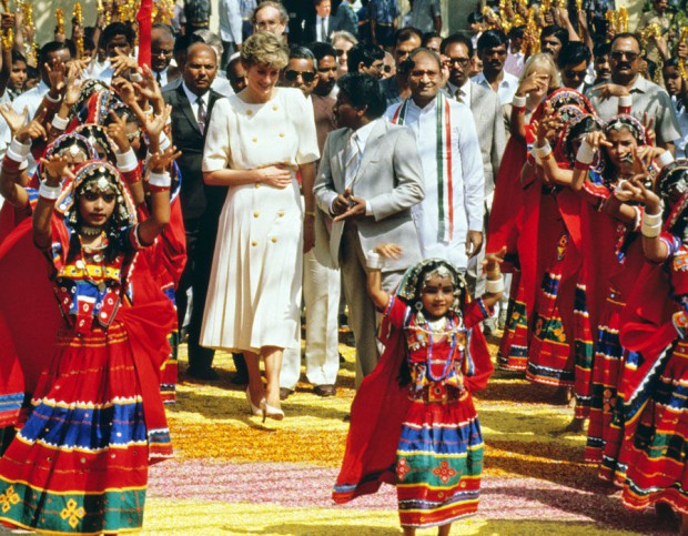 Princess Diana welcomed by a group of dancers during her visit to India