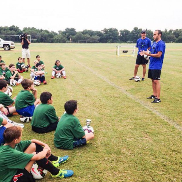 Landon Donovan in a coaching session for kids